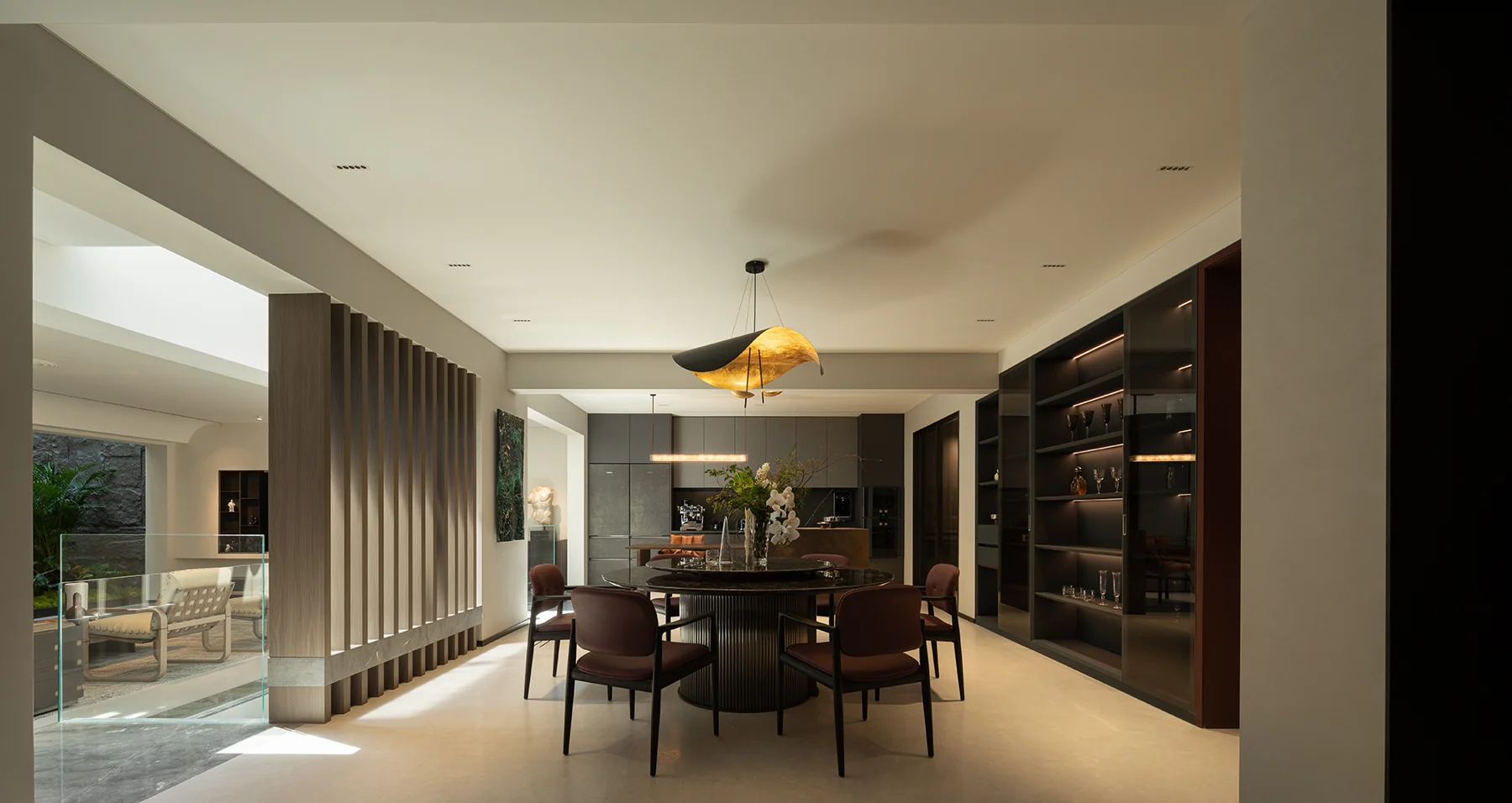 Finished dining area with tall glass display cabinetry